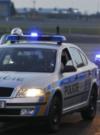 Policejní konvoj jako předzvěst očekávané mezinárodní návštěvy.